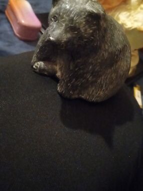 Soapstone sculpture titled 'Bear Laying Down' by Wolf Original